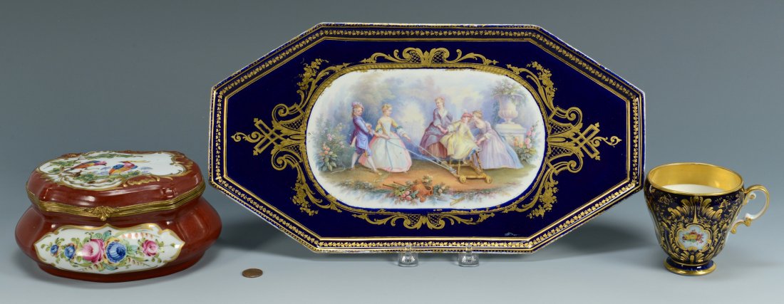 3 Pcs. Continental Porcelain: 1st item: French porcelain platter with cobalt ground and central painted decoration depicting figures playing in a garden. Titled en verso "L'Enfance" with faux Sevres mark. 16" L x 8 1/2" D. Late 19
