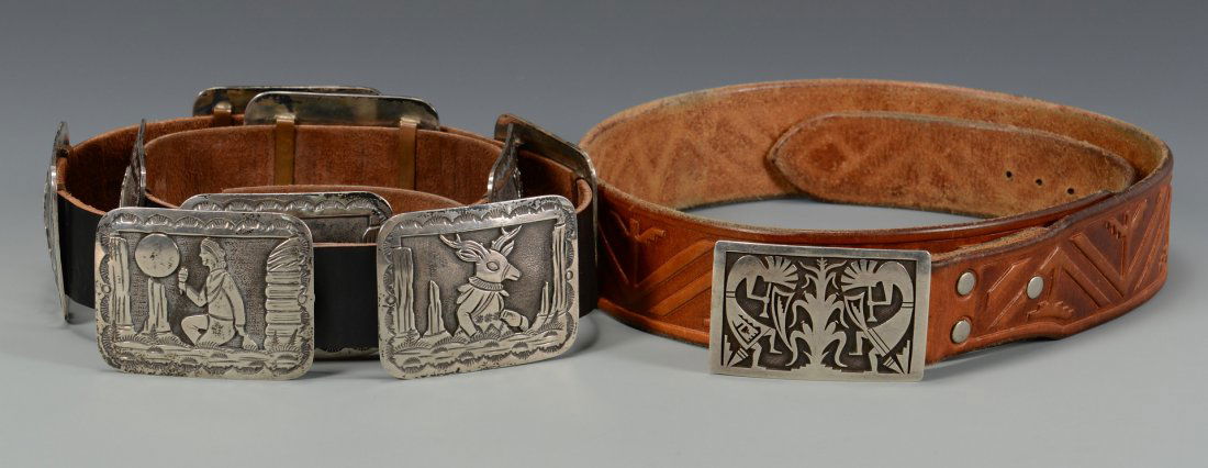 Two Native American Belts w/ sterling buckles: Two (2) Native American leather and sterling belts. 1st item: Robert Becenti Jr. "BCT" Navajo story telling belt with eight (8) sterling conchos and one sterling buckle. Signed on the buckle. 52 1/2"
