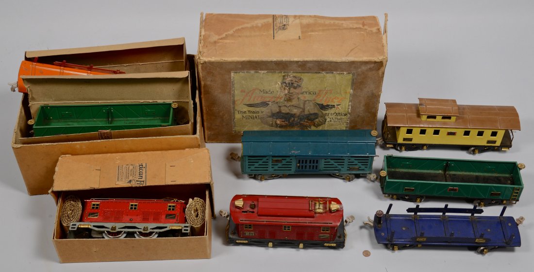 American Flyer Wide Gauge Grouping: Large Grouping of American Flyer Wide Gauge. Includes two (2) 4644 red locomotives (one with the box), green 4020 stock car, blue 4012 flat car, 2 green 4017 sand cars (one with the original box), yel