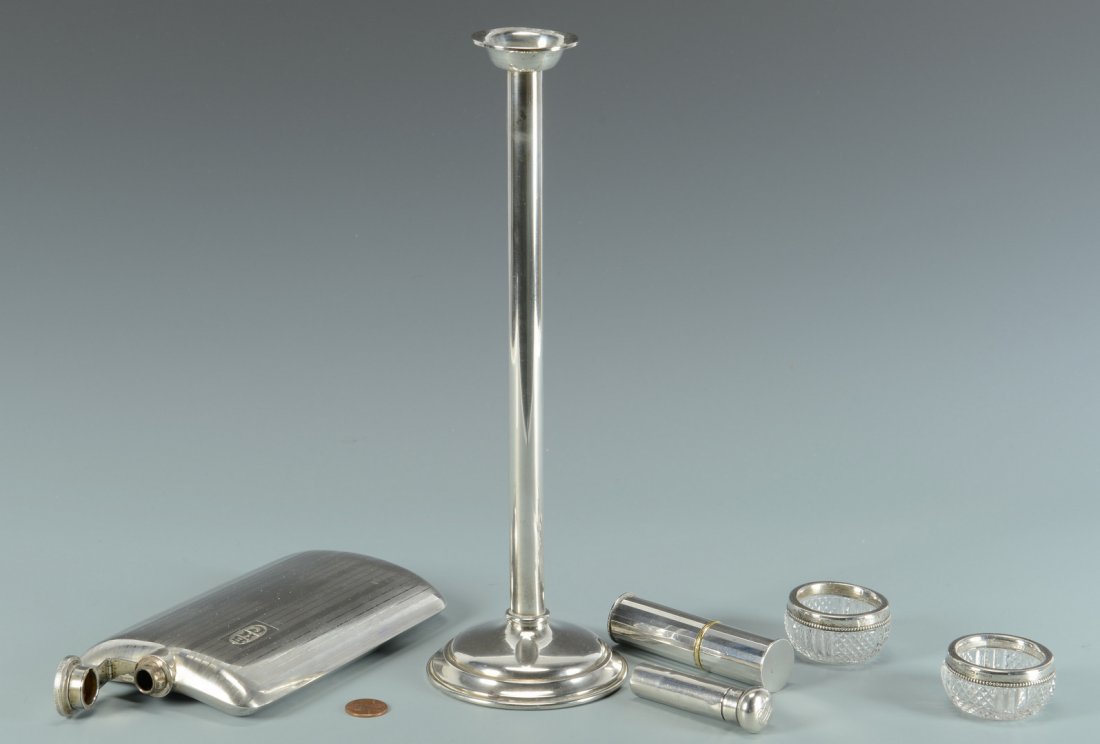 6 pcs Sterling Hollowware: 6 pieces assorted sterling silver hollowware. Includes one large silver flask with striped design and Art Deco monogram BKC, marked Sterling, 6-1/2" x 4"; 1 tall taper candlestick, mark for Mauser Ste