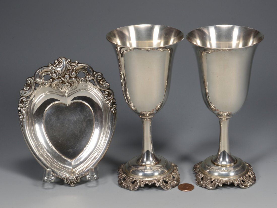 Pr. Sterling Grande Baroque goblets w/ heart dish: Pair sterling silver Wallace Grande Baroque goblets, 7" H and one Wallace Grande Baroque sterling heart shaped dish, 1" H x 4 1/2" W x 6" D. 15.815 oz troy total.