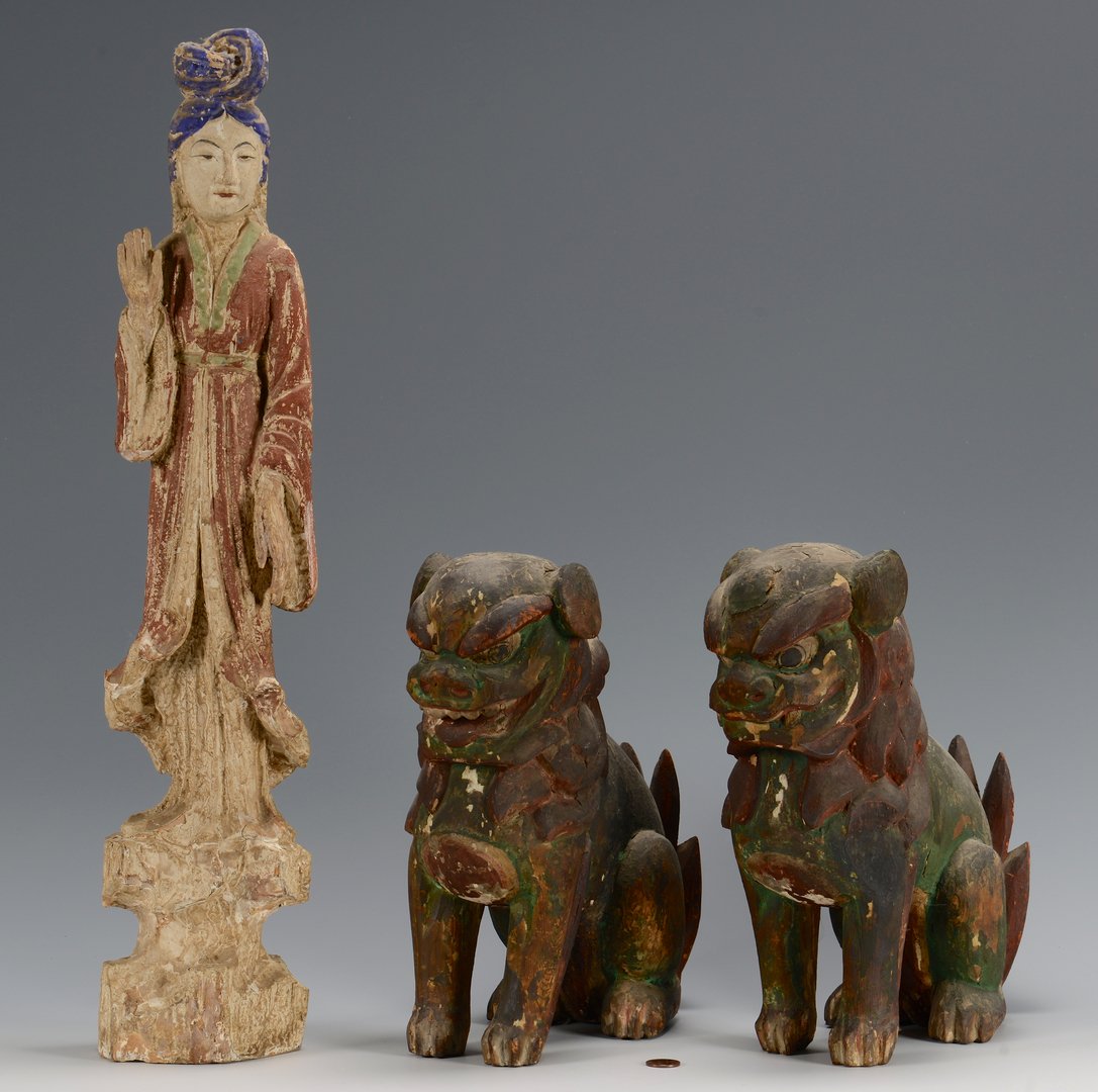 Carved Quan Yin and Foo Dogs: 1st item: A carved and polychrome painted wooden figure of Quan Yin, with blue headdress and red robe, standing on a white base of stylized clouds, 22 1/2" tall. Chinese, Late 19th/Early 20th century.