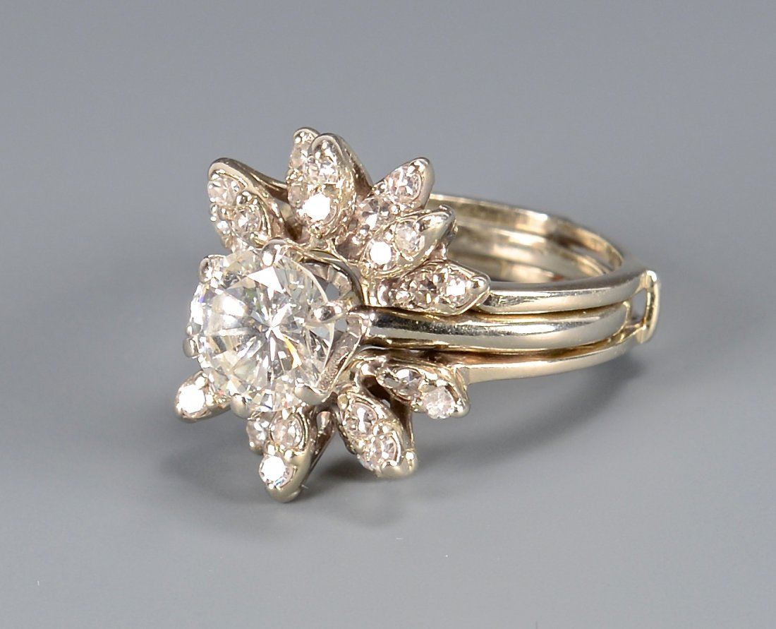 2.02 Carat Diamond ring with guard: 14k white gold 2.02 carat diamond solitaire ring with diamond guard. 2.02 ct diamond set in 6-prong mounting and measures 8.21-8.20 x 4.91 mm, SI-2 clarity, G-H color, 3.5 grams. Starburst designed di