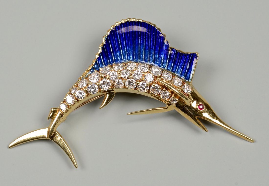 18k Enamel Diamond Marlin Brooch: 18k diamond blue enamel marlin brooch, 26 round brilliant diamonds weighing between .03 to .15 ct with a total weight of 1.80 cts, VS1-2 and F-G color. There is also one small round cut ruby eye, appr