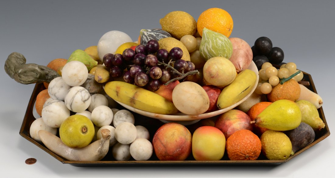 Large Collection of Stone Fruit: Large collection, approx 50 pieces, of carved stone fruit, some natural marble and some painted stone. Types include grapes, bananas, peaches, cherries, apples, lemons, figs, onions, lemons and pears.