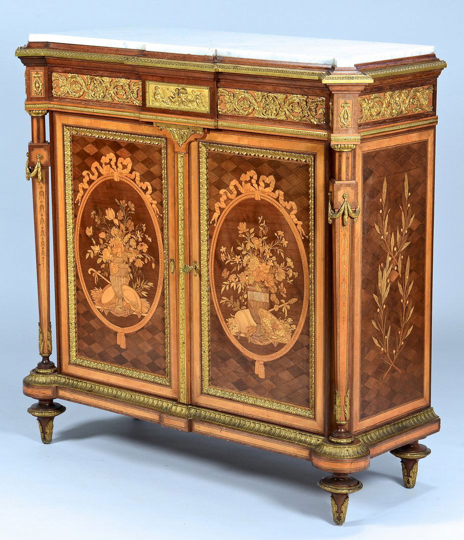 French Commode, Paillard Bronze Mounts: Exceptional Napoleon III marble topped marquetry cabinet in the Louis XVI style, with signed gilt bronze mounts by Victor Paillard, (French, 1805-1886). Elaborately inlaid two door case case comprised