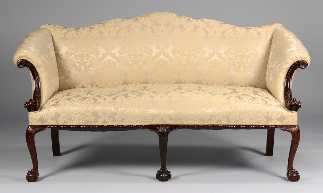 Centennial Irish Chippendale Sofa: Centennial Irish Chippendale diminutive sofa or settee with serpentine back, mahogany s-scroll carved arms and acanthus leaf arm supports, three front cabriole legs ending in ball and claw feet, two s