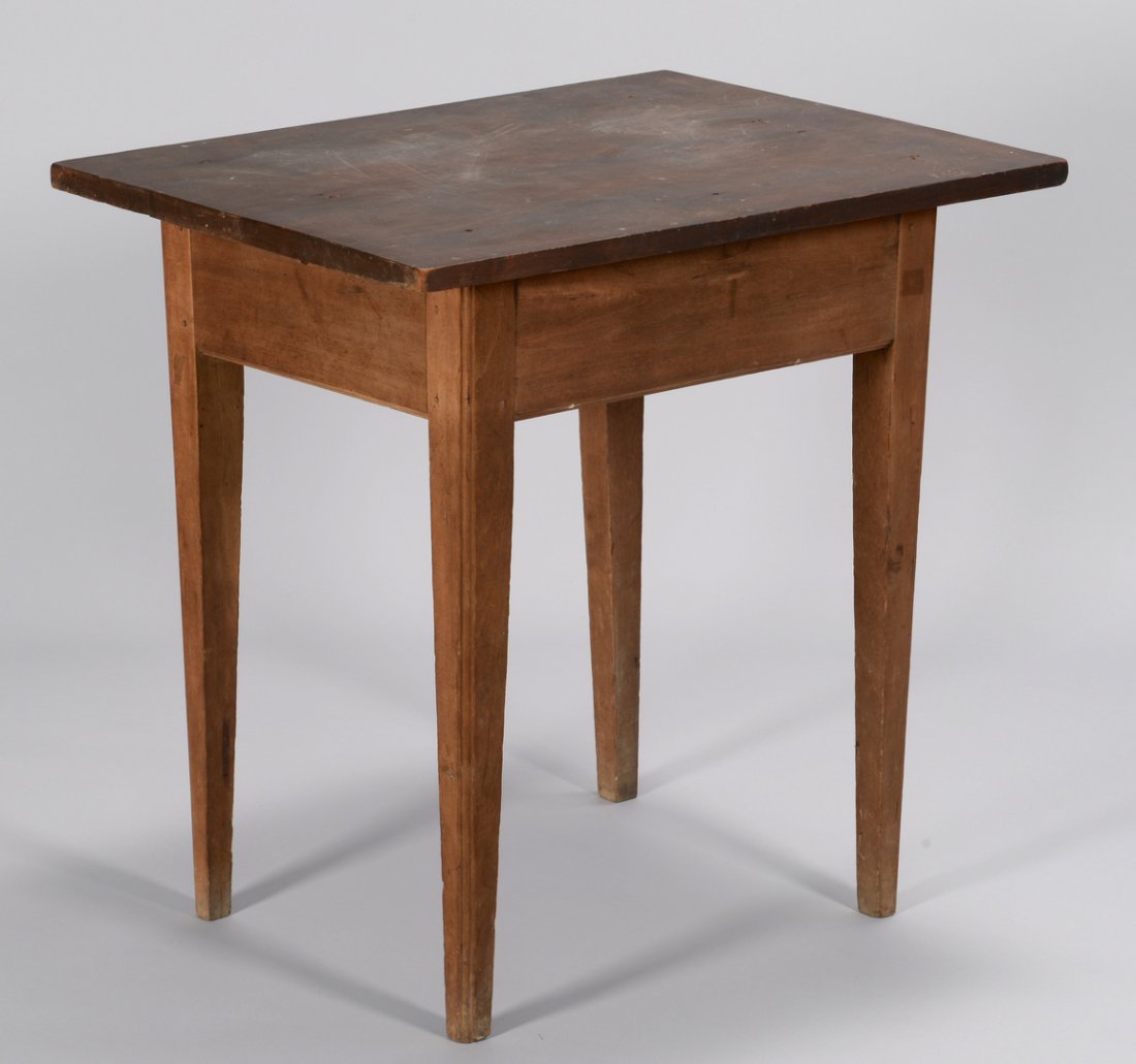Tennessee Hepplewhite Cherry Table: Early Middle Tennessee cherry table in the Hepplewhite style with tapered legs, possibly Wilson Co. Single board top, lower apron edge with ogee molding and corners of tapered legs with reeded edges. 