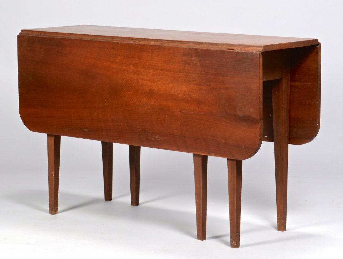 East TN Cherry Drop Leaf Table: Knox County, Tennessee cherry drop leaf table with Hepplewhite style tapered legs and leaves with rounded corners. Pegged construction. 28 7/8", 45 1/4" length, 44" with leaves extended. Circa 1835. P