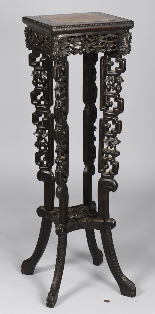Square Carved Chinese Pedestal: Carved Chinese stand with square top having a rouge marble insert, floral carved apron and tiered shelf with pierced fretwork; splayed legs ending in shaped claw feet. 36 1/2" H x 11 1/8" square top. 