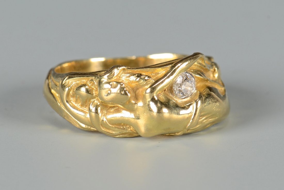 18K Art Nouveau Female Nude Ring: 18K yellow gold Art Nouveau vintage free form ring of female nude and containing one old European cut diamond weighing approximately .10 ct, (E-F color, I2 clarity), 9.9 grams. Ring size 8 3/4. Gold t