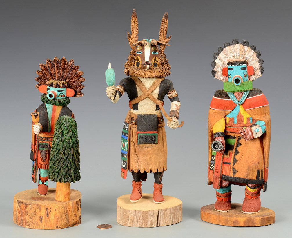 Grouping of 3 Hopi Kachinas: Grouping of three (3) Native American Hopi Kachinas, one signed "Troy Nasa" depicting a Kachina with rattle standing by a tree, one signed "Makil" titled "Morning Kachina" and one signed "Tina Yawella