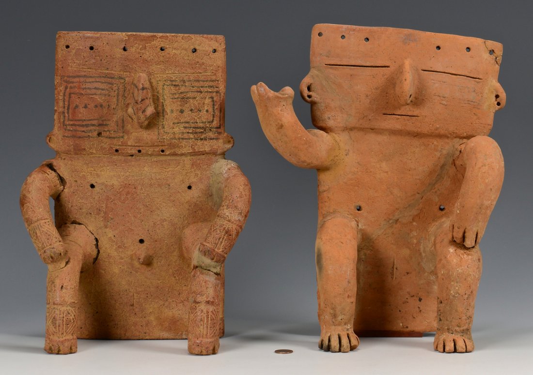 2 South American Quimbaya Pottery Figures: Two Pre-Columbian, Colombia, South America, Quimbaya seated stylized terracotta human effigy figures both with unslipped bodies and multiple holes in the bodies and heads, once used for adornments. On