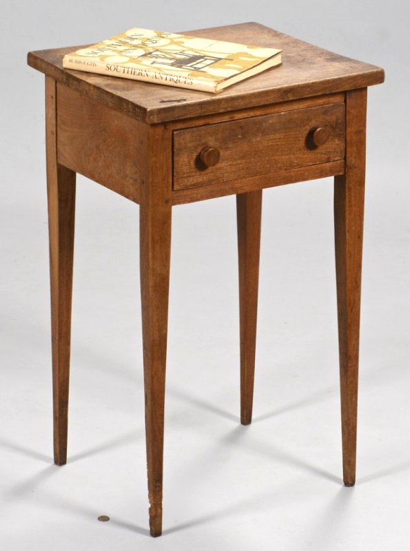 East TN Hepplewhite Walnut Stand & Southern Related: 1st item: East Tennessee diminutive Hepplewhite one drawer stand, walnut primary, poplar secondary wood, with tall tapered legs, dovetailed drawers, pegged construction. 29" H x 17 3/4" W x 14 3/4" D.