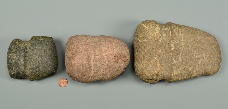 Three 3/4 Native American Axes: Grouping of 3 Three Quarter grooved axes, granite and other stone. Dimensions for each: 7 1/2" x 5 1/2", 3 1/2" x 4 1/2". and 5" x 4".