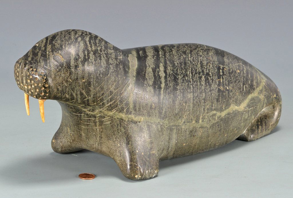 Large Native American Inuit Carved Walrus: Large Native American Inuit carved green soapstone walrus with bone tusks. Signed on the base "E. 9.12.88". 18" L x 5 3/4" W. 20th century. Provenance: Estate of Bill Zarnon, Gatlinburg, Tenn. (Additi