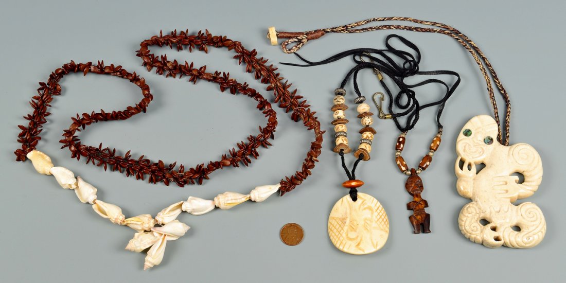 Group of 4 Carved Ethnic Necklaces: Group of four (4) carved ethnic necklaces, possibly South Pacific. 1st item: A seashell and seed necklace strung on dark string. 2nd item: A carved bone and bead necklace having central carved bone pe