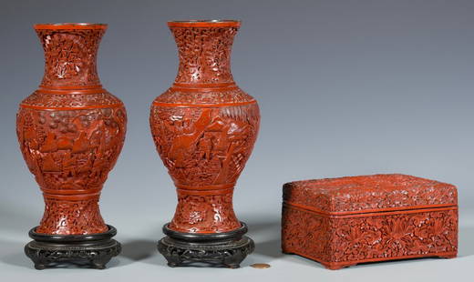 Chinese Cinnabar Vases & Box: 1st & 2nd items: Pair of Chinese carved cinnabar vases with floral, figural and landscape decoration. Both fitted with carved hardwood stands. 8 3/4" H. 20th century. 3rd item: Chinese rectangular