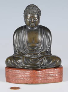 Japanese Signed Bronze Buddha: Japanese bronze sculpture of Buddha, depicted seated with hands in the Dhyana mudra and legs in the double lotus position. Three (3) incised character marks to the base. Fitted with a carved hardwood