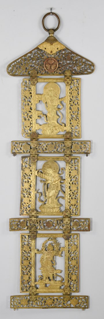 Japanese Gilt Copper Buddhistic Hanging: Japanese sectional relief carved gilt copper hanging, comprised of a pierced foliate top with three hinged pierced panels depicting Buddhist dieties, joined by rectangular pierced foliate panels. 54 3