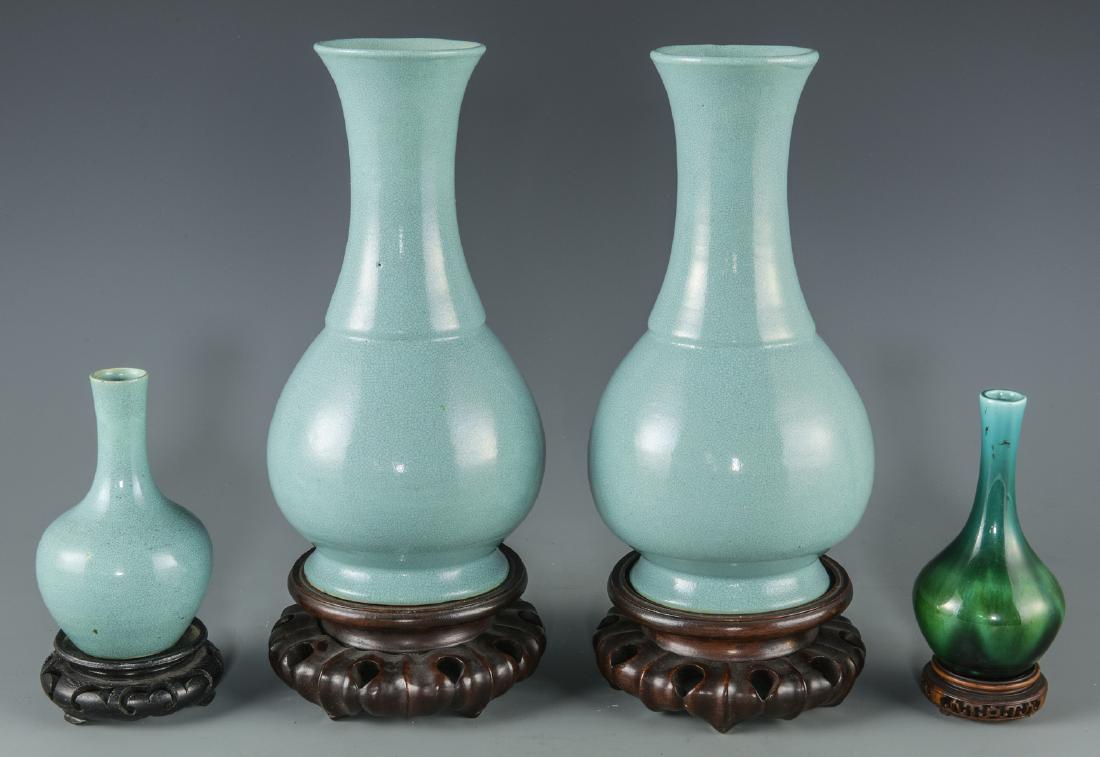 4 Chinese Porcelain Bottle Vases w/ Stands: 1st & 2nd items: Pair of Chinese porcelain robin's egg blue bottle vases with slightly flaring rims. Both fitted with hardwood stands. 8 1/4" H. Both 20th century. 3rd item: Miniature Chinese porcelai