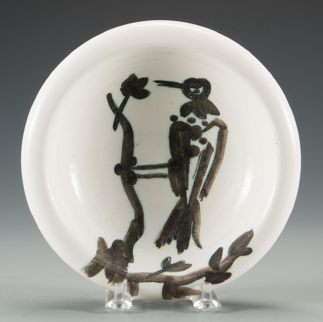 Picasso Ceramic Dish and Print: Pablo Picasso (Spanish, 1881-1973) turned white earthenware clay dish with white enamel and black glaze, depicting a bird on a branch. Edition of 500. Signed EDITION PICASSO and stamped MADOURA and ED