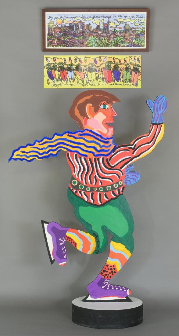 Myles Maillie Skating Figure: Myles Maillie (American/Tennessee, b. 1951) , painted wood figure of Red Grooms ice skating. Depicts the red-headed Grooms as a young man in brightly colored clothing and ice skates, atop a round blac