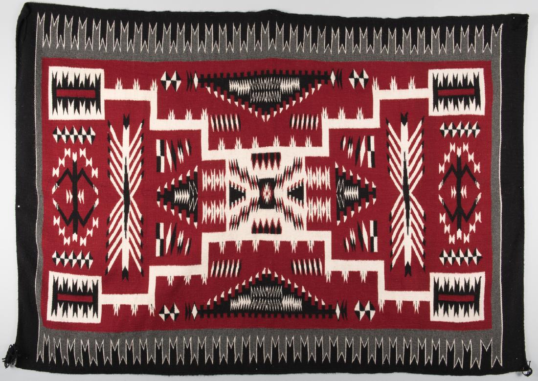 Navajo Crystal Storm Pattern Rug: Navajo Crystal Storm Pattern rug woven in colors of red, cream, black and grey, waterbug symbols to each end and a radiating zigzag border. 75" x 52 1/4". 1st half 20th century. Provenance: Collection
