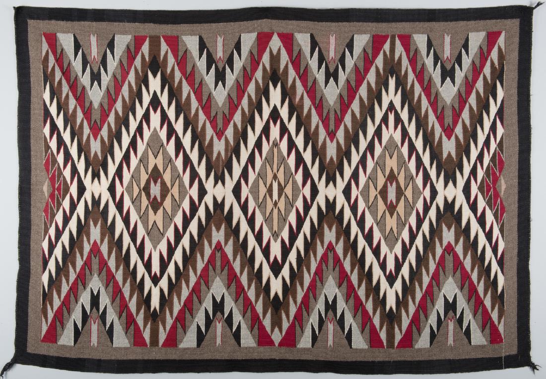 Navajo Eyedazzler Rug: Navajo Eyedazzler rug, beige field with colors of red, black, grey, tan and natural and black border, spirit line to one corner. 62" x 43". Weaver: Alice Roye. 20th century. Purchased from Southwester