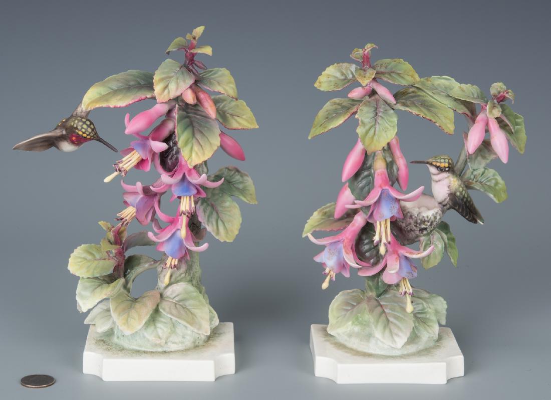 Pair Dorothy Doughty Hummingbirds: Pair of Royal Worcester Ruby Throated Hummingbirds, modeled by Dorothy Doughty, comprising a cock and hen, each painted in polychrome enamels. Ranging in size from 9 3/4" H to 10 1/4" H. Note: each fi