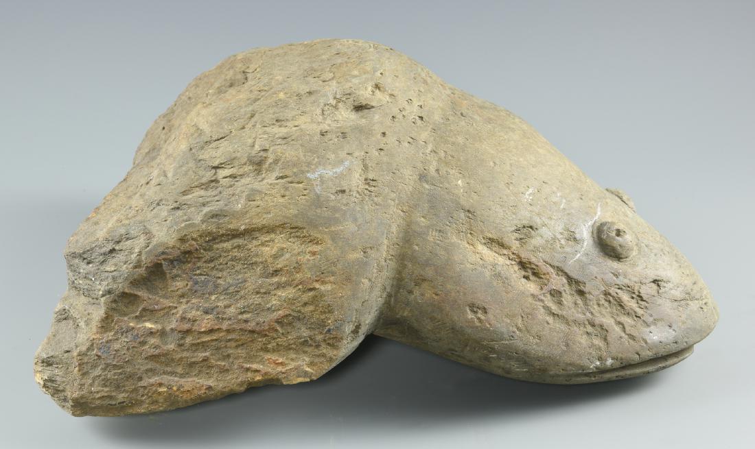 Raymond Coins, Folk Art Frog Carving: Raymond Coins (North Carolina, 1904-1998) stone folk art carving of a crouching frog. Unsigned. 8" H x 16 1/2" W x 16 1/4" D. 74.6 lbs. Late 20th century. Provenance: Property of the Arts Center of Ca
