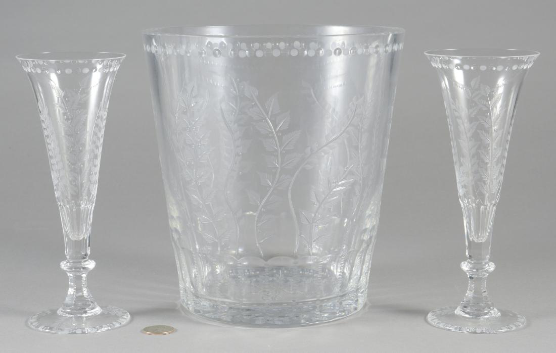 William Yeoward "Fern" Ice Bucket & 2 Flutes: William Yeoward "Fern" pattern crystal ice bucket and 2 champagne flutes. Stamped "William Yeoward" on base. Ice Bucket - 9" H x 8 1/4" dia. Champagne Flutes - 8" H X 3 1/2" dia. Late 20th/early 21st