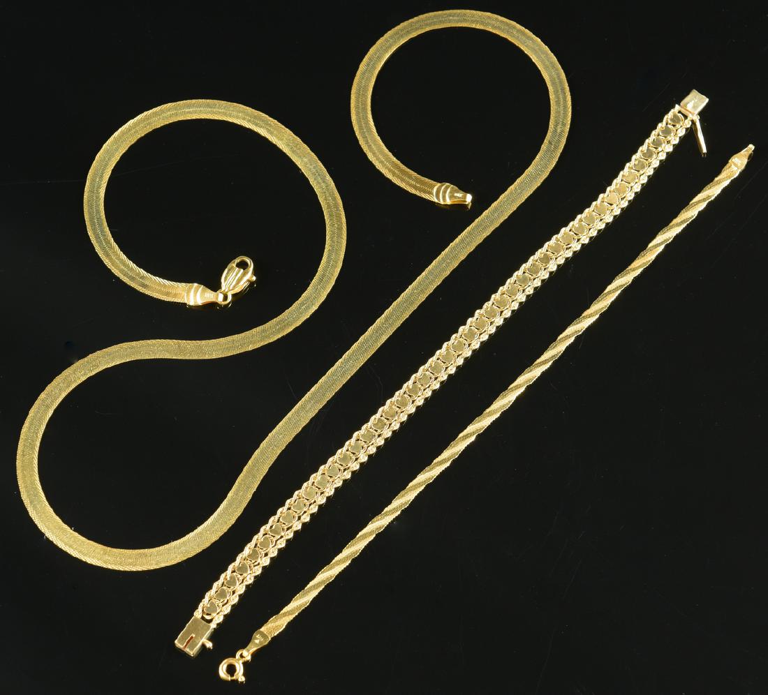 14K Necklace & 2 Bracelets: 1st item: 14K yellow gold herringbone necklace, marked Italy, 3/16" W x 22" L with lobster claw clasp. 2nd-3rd items: Two 14K yellow gold chain bracelets, one with hearts (7 1/4" L) and other with her
