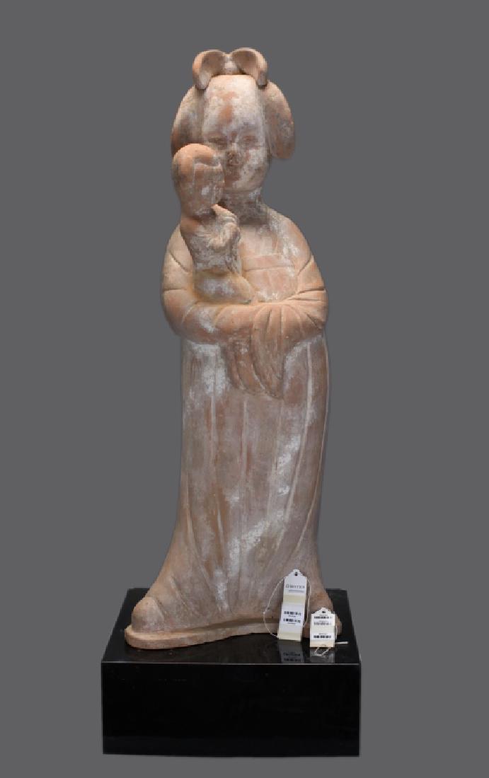 Chinese pottery fat lady holding a child: provenance: Christie's; possibly Tang dynasty; without base: 33in(H) x 12in(L) x 10in(W)