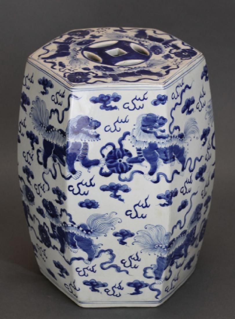 Chinese blue & white porcelain garden seat: hexagonal garden seat painted with Buddhist lions amidst clouds and flames; 15.5in(H) x 9.5in(L) x 9.5in(W)