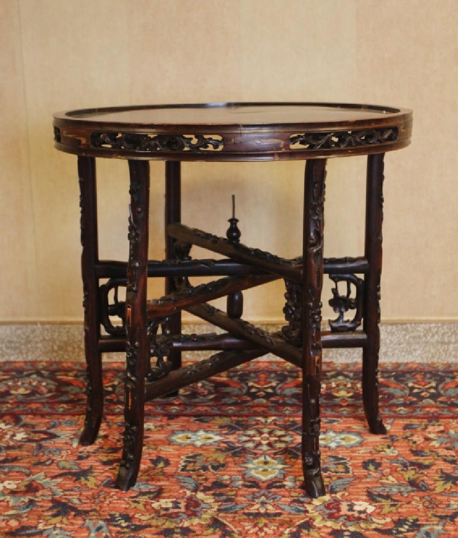 carved Chinese hardwood table, 19th c.: carved with cherry blossoms in relief; 22in(diameter) x 21.5in(H)