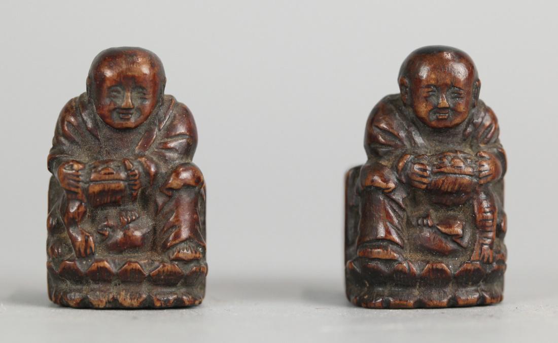 pair of carved wooden birdcage feeders (1 of 5)