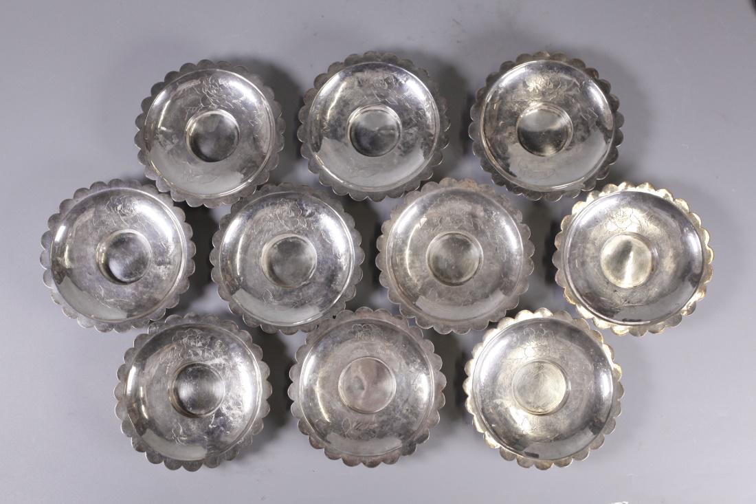 group of 10 Chinese silver saucers, possibly 19th c. (1 of 4)