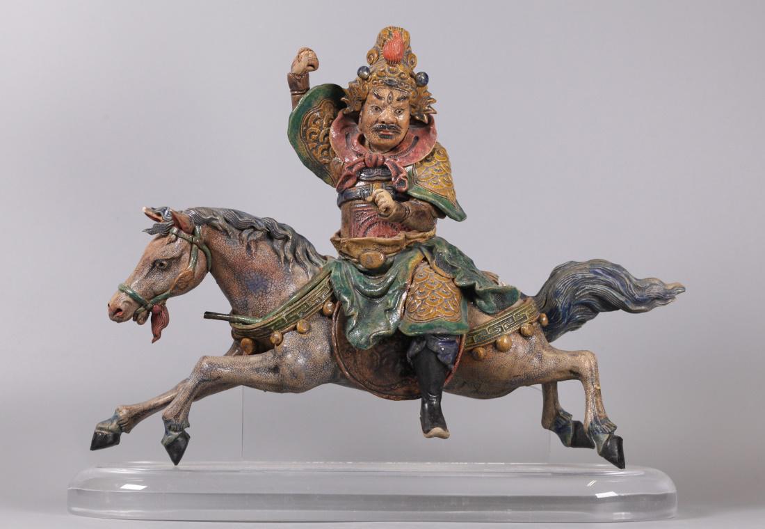 Chinese porcelain roof tile: roof tile of a warrior riding a horse; overall: 16in(L) x 13in(H)
