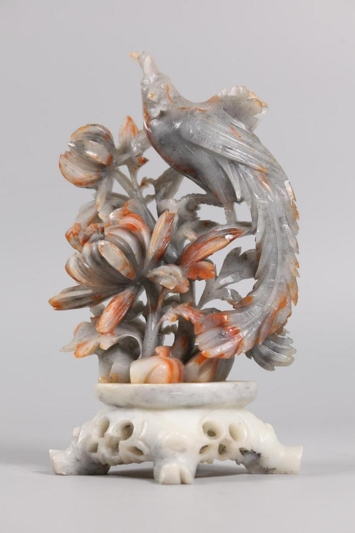Chinese soapstone carving of a bird: 7in(H); Notice to bidders: Condition reports are not included in the lot's description. Condition reports and additional photographs are provided upon request. Condition reports are knowledgeable opin