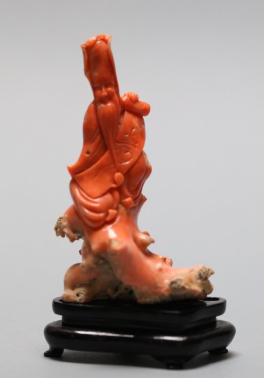 Chinese coral longevity figure: without base: 3.82in(H) x 2.20in(L); Notice to bidders: Measurements are approximate. Condition reports and additional photographs are provided upon request. Condition reports are knowledgeable opinio