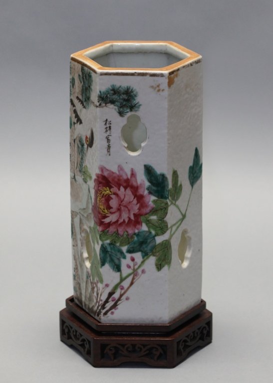 Chinese hexagonal porcelain hat holder, Qing dynasty: floral motif, original hexagonal wooden base, without base: 10.65in(H) x 5.2in(L); Notice to bidders: Measurements and weights are approximate. Condition reports and additional photographs are provide