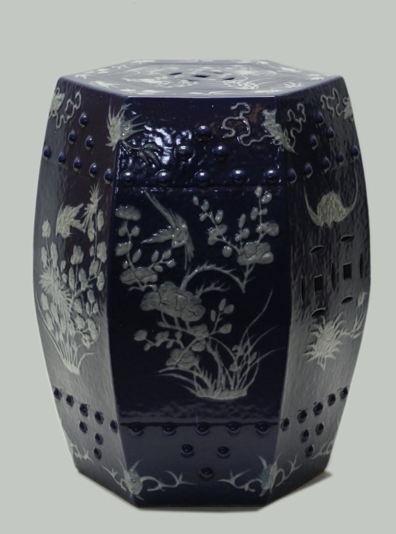 Chinese hexagonal garden seat (Qing dynasty): porcelain, white floral and bird motif against deep blue ground, 18.5in(H) x 15.5in(L); Notice to bidders: Measurements and weights are approximate. Condition reports and additional photographs are pr