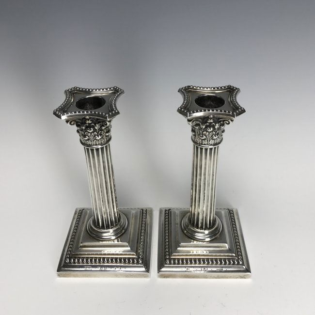 A PAIR OF STERLING SILVER CANDEL HOLDERS (1 of 2)