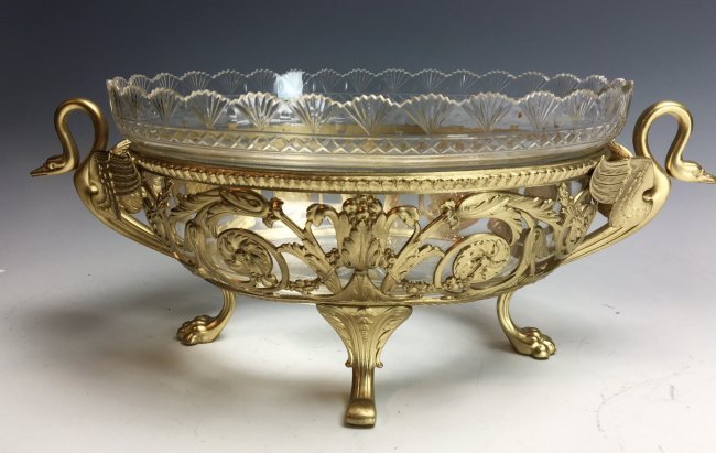 19TH CENTURY GILT BRONZE AND CUT CRYSTAL CENTERPIECE: Empire style , 15" Long. Excellent condition. Estimate $1.000-1.200