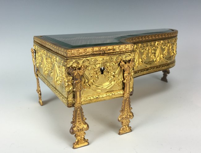 A DORE BRONZE & CUT GLASS PIANO SHAPPED BOX: Circa 1900. Measures 10.5" X 6.5" X 4.5" H. Estimate $800-1.000