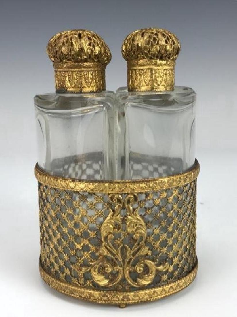 BACCARAT GLASS AND GILT BRONZE PERFUME SET: Circa 1900. Measures 7" H. Excellent condition. Estimate $300-400