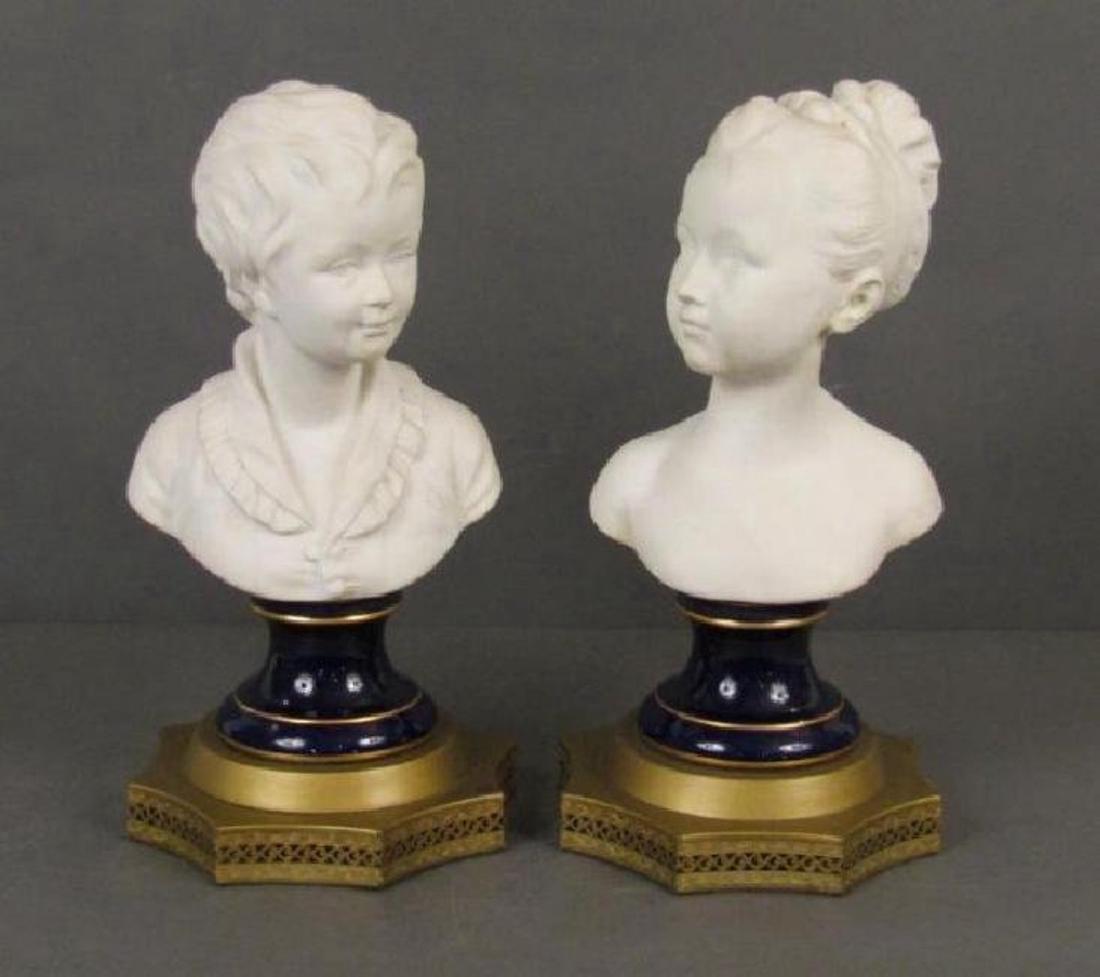 A PAIR OF ANTIQUE FRENCH LIMOGES PORCELAIN BUSTS: pair of bisque porcelain busts. Signed D.Houdon, C.Tharaud Limoges France. l10"W X 10"D X18"HEstimate $600-800