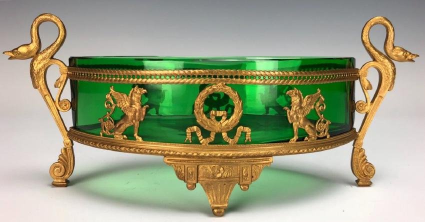 EMPIRE STYLE ORMOLU MOUNTED BACCARAT GLASS CENTERPIECE: Circa 1900. Measures 3.5 "x 11.5 "x 4". Excellent condition. Estimate $1.000-1.200