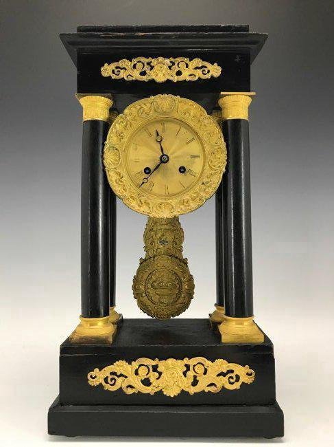 19TH C. EMPIRE STYLE DORE BRONZE MOUNTED MANTEL CLOCK: 19th Century Dore bronze mounted ebonized wood pendulum mantel clock., 15" High. Estimate $500-600